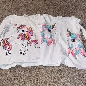 2 H&M unicorn shirts